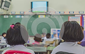 Young students are studying in classroom.
