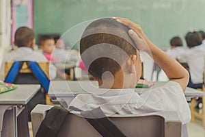 Young students are studying in classroom.