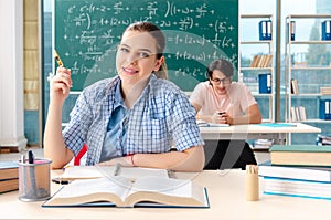 The young students taking the math exam in classroom