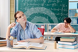 The young students taking the math exam in classroom