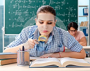 The young students taking the math exam in classroom