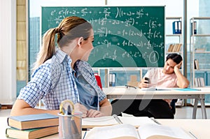 The young students taking the math exam in classroom