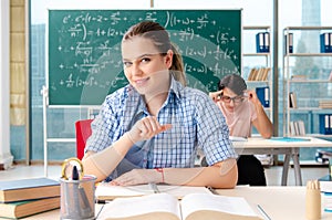 The young students taking the math exam in classroom