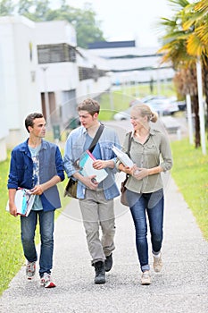 Young students walking outside campus