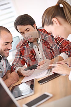 Young students working with electronical devices