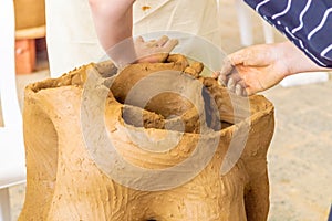 Young students working on their sculpture in an atelier