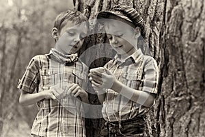 Young stylish boys browse the mobile internet photo