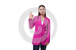 young stylish business assistant woman dressed in a bright pink jacket