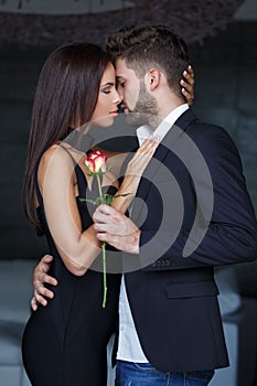 Young stylish couple before kissing indoors