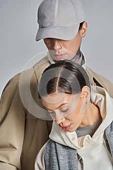 A young stylish couple in trench