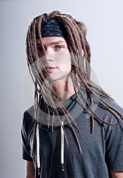 Young stylish guy with dreadlocks.