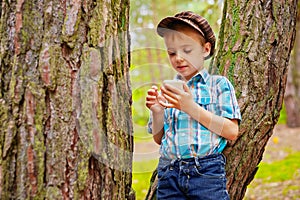 Young stylish kid reading sms