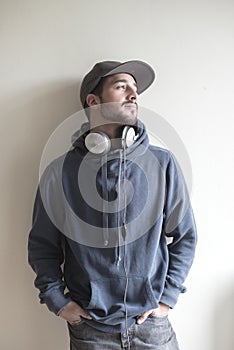 Young stylish man listening to music