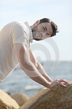 Young stylish man portrait dressed in white polo shirt