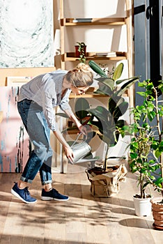 young stylish woman in eyeglasses watering