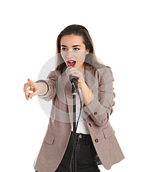 Young stylish woman singing in microphone on white