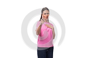 young stylish woman with straight black hair is wearing a pink t-shirt with mockup