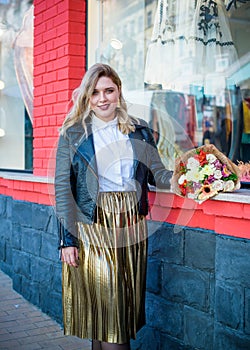 Plus size nice woman in suit at street, spring trends