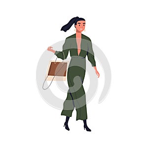 Young stylish woman wearing fashionable jumpsuit. Adorable female character walking in fashion clothes with trendy