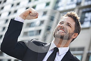 Young Successful Business Man Celebrating in City photo