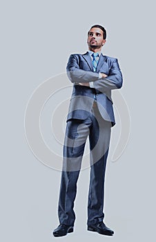 Young successful business man isolated on white background.