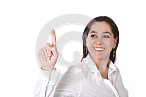 Young successful businesswoman pointing with finger to copy space