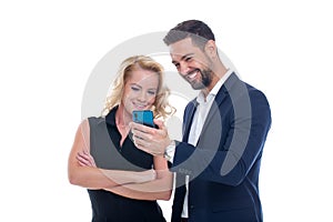 Young successful CEOs watching data on smartphone isolated on white