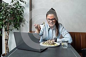 Young successful happy business woman on her lunch break takes the opportunity to have a video call with her boyfriend who works