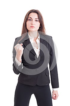 Young successful and powerful business woman showing fist