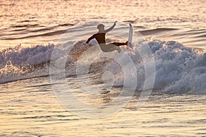 Young surfer enjoying waves