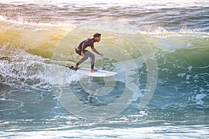 Young surfer enjoying waves