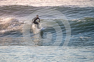 Young surfer enjoying waves