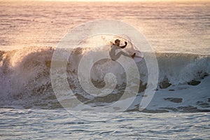 Young surfer enjoying waves