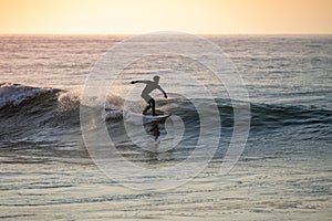 Young surfer enjoying waves