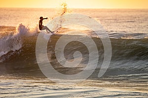 Young surfer enjoying waves