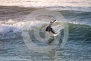 Young surfer enjoying waves