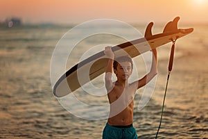 Young surfer man going surfing on beach banner panorama. Water Sport