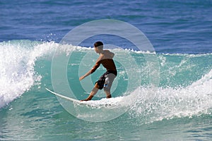 Young Surfer Surfing