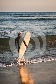 Young surfer about to catch some waves