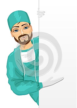 Young surgeon green scrub presenting empty banner