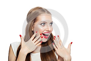 Young surprised woman isolated on white background. Laughing girl with makeup, healthy hair and red manicure