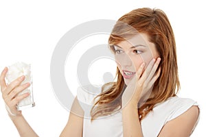 Young surprised woman with lot of cugar in glass