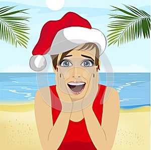 Young surprised woman wearing santa hat on beach, christmas theme