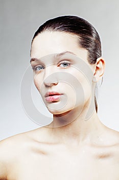 Young sweet brunette woman close up isolated on white background, perfect pure innocense freshness face, spa healthcare