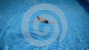 The young swimmer is an athlete in the pool. swimming lessons children
