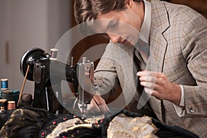 Young tailor at work.