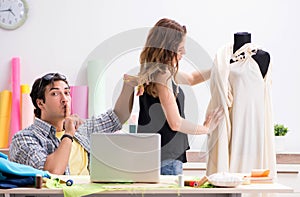 Young tailor working in his workshop