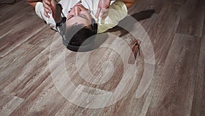 Young tanned man close-up in a white t-shirt at home listening to relaxing music. relaxation relaxation, turning off the