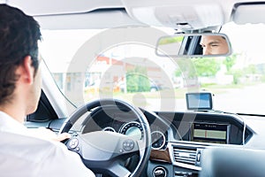 Young Taxi driver driving his car photo