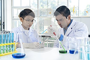 Young teacher and student boy in science class at laboratory